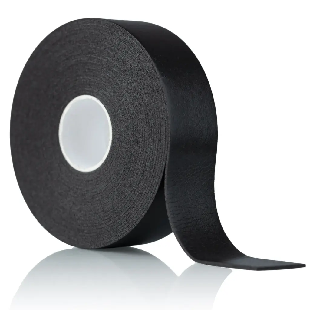 A roll of black textured tape with a loose strip extending across a white background.